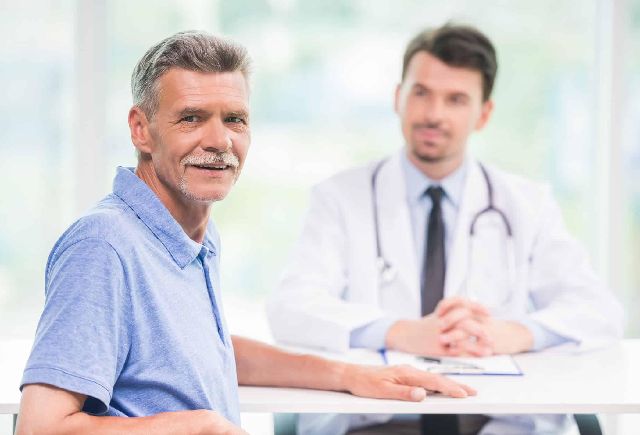 Patient and doctor sitting down.